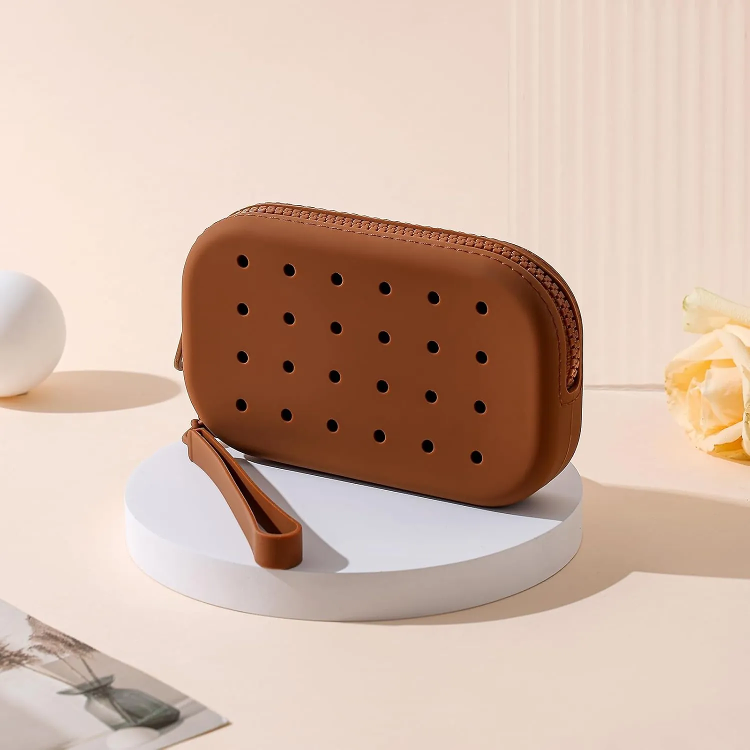 JOVAKIT Small Portable Silicone Makeup Bag for Women with Decorative Holes, Travel Waterproof Toiletry Cosmetic Bag Gifts for Women, Zipper Closure Makeup Case with Handle (Brown)